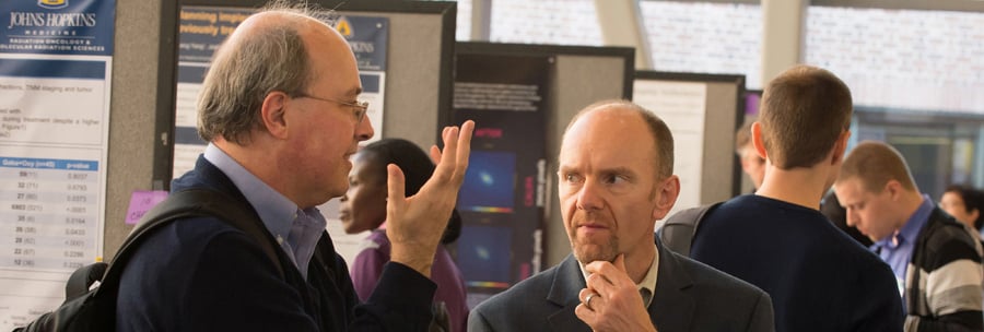 IDIES members Charles Meneveau and Tom Haine at a previous symposium