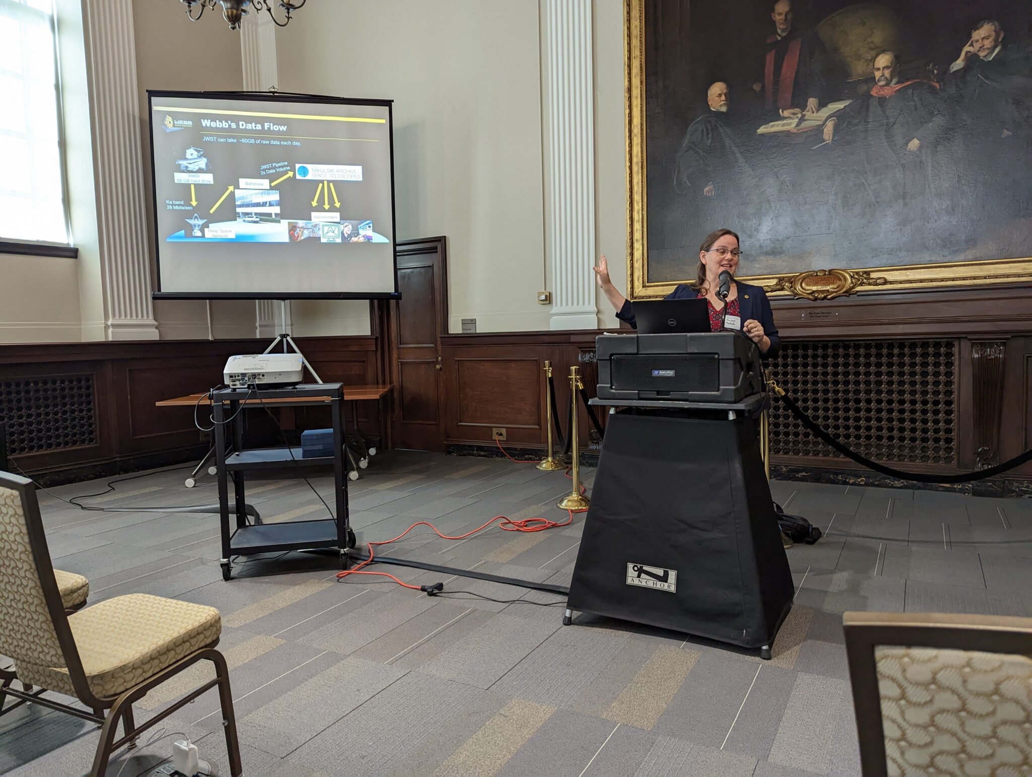 Janis Taube speaking at the 2022 symposium