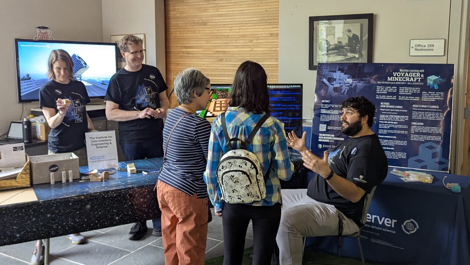 IDIES team members explain how AI works through video games at the phyisics far. 